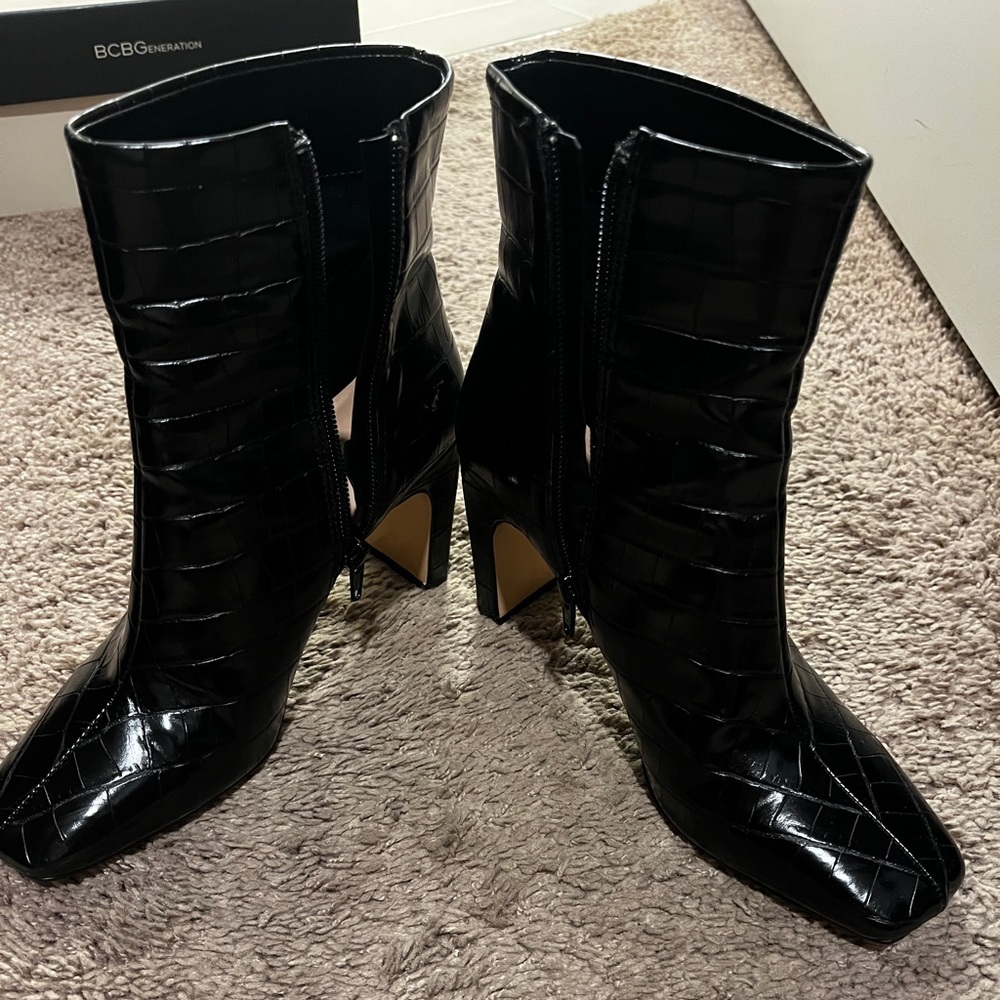 BCBG black mid shaft booties with zipper. Like new. Size 6.